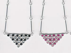 Rhinestone silver tone necklaces with a  triangle shape. These are perfect for dressy or casual occasions. The length can be adjusted from 14 to 17 inches.